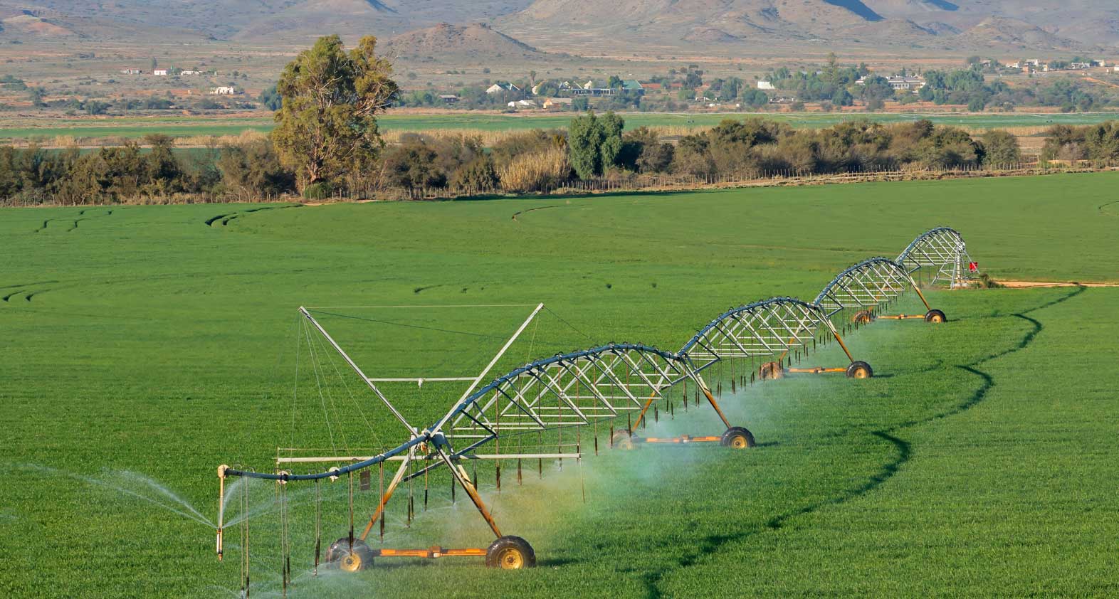 Outdoor irrigation using a sprinkler system on a green space