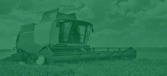 Agricultural Technology: A modern combine harvester harvesting a barley field