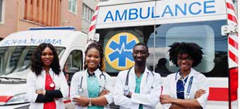 Wendit Health Equipment Division: Four female paramedics in front of Wendit ambulances